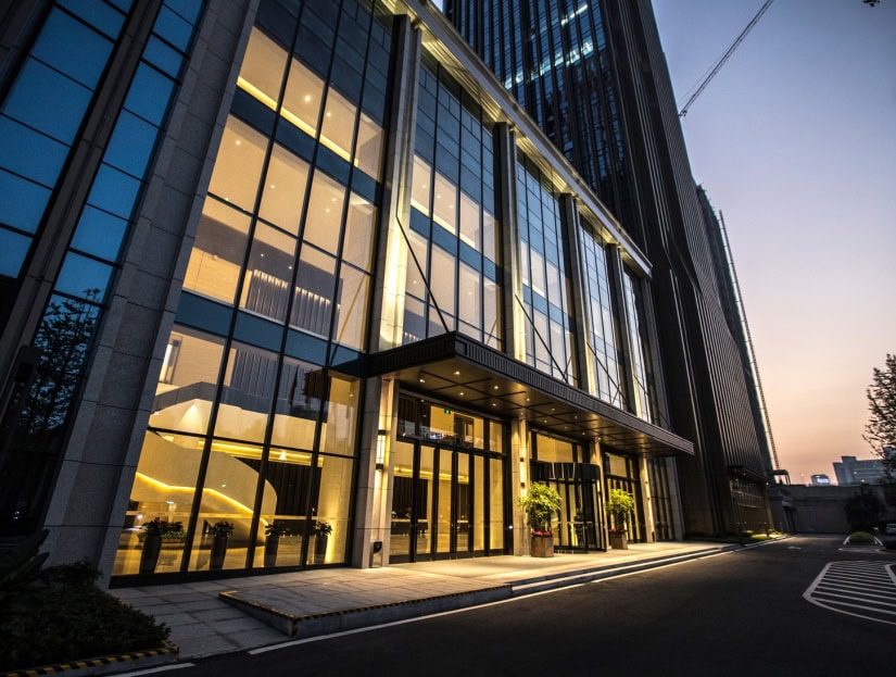 Showing a modern glass commercial building linked to property finance
