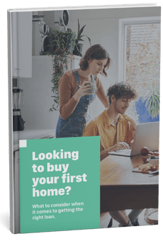 Showing couple researching first home loan options on a laptop.