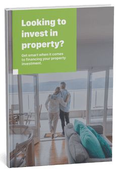 Showing couple overlooking water from balcony of property investment.